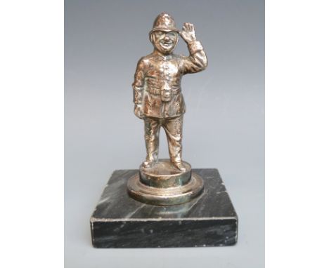 A policeman car mascot with lamp to belt, height including base 12cm 