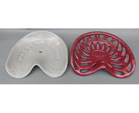 Two cast iron tractor or implement seats, one Walter A.Wood the other Jones