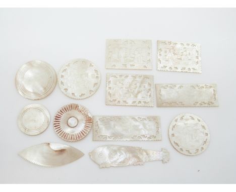 Five rectangular and two circular Chinese mother of pearl counters depicting figures, one in the form of a fish and four othe