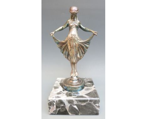 A car mascot formed as an Art Deco girl holding her dress, marked to base Finnigans London, 7/25, 17360, Made in France and C