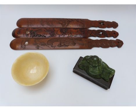 Three Chinese carved wooden page turners length 43cm, a spinach jade style Buddha and a yellow hardstone bowl