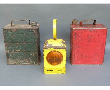 Two 2 gallon petrol cans, one Pratts dated 31 the other Shell dated 50 and a Dorman Paralamp road lamp