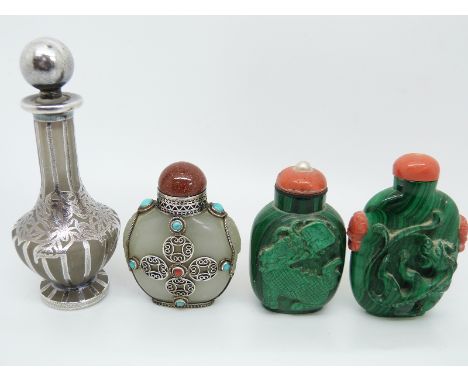 A Chinese malachite scent bottle carved in relief depicting a dragon with coral stopper and coral handles, a 19thC / early 20