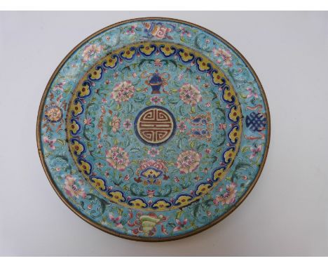 A 19thC Chinese copper on enamel dish decorated with flowers on aqua ground, 19cm