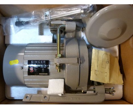 A Singer sewing machine unused ½ HP electric motor in box with instruction leaflet