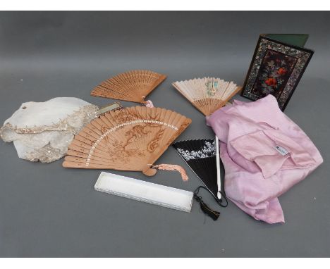 A mother-of-pearl inlaid lacquer book cover, boxed wooden fans, an Art Deco beaded 'snake' scarf and other beaded items etc