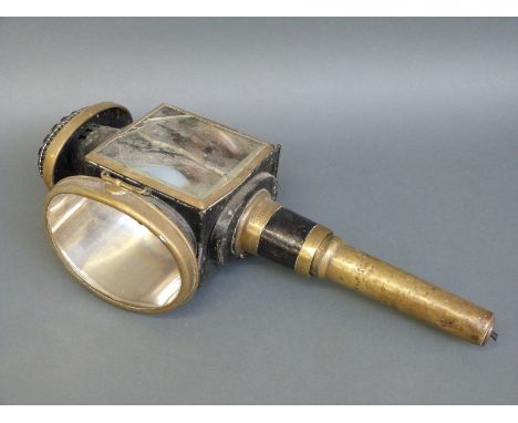 A brass and iron carriage or coaching lamp, marked Patent No. 2070 and the candle holder marked Alfd Miles, Cheltenham, H58cm