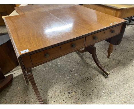 Mahogany two drawer sofa table raised on outswept legs with brass end caps and casters, 90cm wide when closed