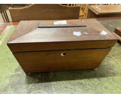 A 19th Century rosewood sarcophagus formed tea caddy with sub-divided interior raised on bun feet, 29cm wide (a/f)