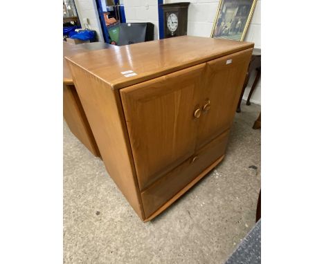 Ercol light elm television cabinet with two doors and drop down front, later internal modification, 85cm wide