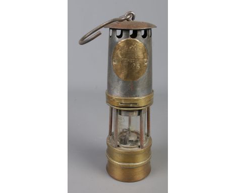 A Hailwood and Ackroyd of Morley, Leeds, Type 01B miners safety lamp. Stamped number 1925 and includes swing handle.
