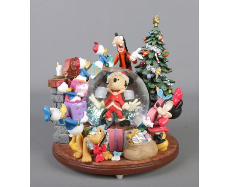A Disney Mickey Mouse & Friends Christmas snow globe Hx21cm