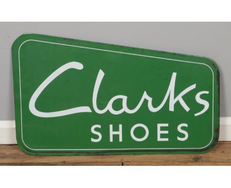 A Clarks Shoes enamel sign. Width: 76cm.