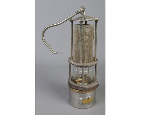 A vintage Davy miners safety lamp with swing handle. Glass inscribed 'HSW 1985' with lamp stamped 'LB1 A-18834-85-11' and 'BS