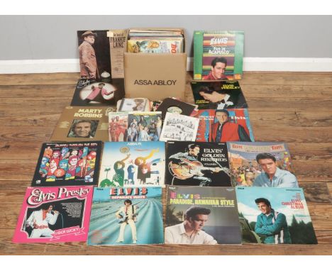 A collection of assorted vinyl LP and single records. including ABBA, Marty Robbins, Shakin Stevens and Elvis Presley collect