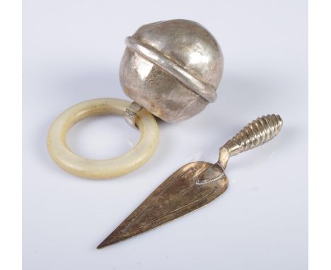 A silver bookmark in the form of a trowel, together with a silver bell and mother of pearl teething ring. The bookmark assaye