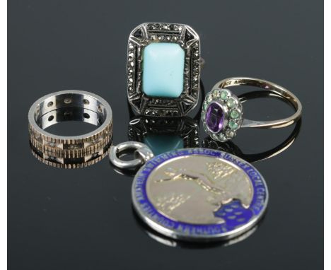 Three 9ct gold and silver paste set rings along with a silver and enamel swimming medal. Medal for Southern Counties Amateur 