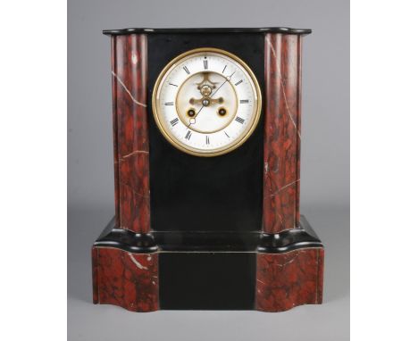 A black slate and red marble mantle clock with visible escapement and roman numeral dial.Hx38cmWx32cm  No pendulum or bell.