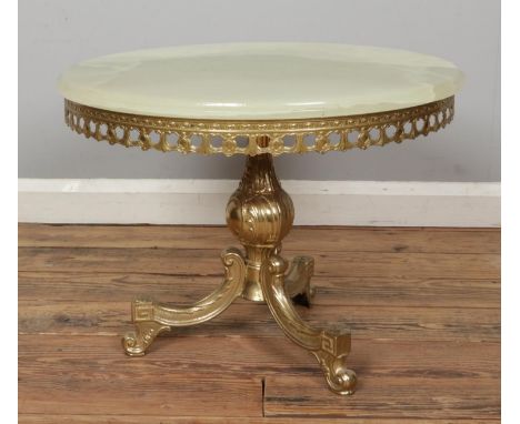A small onyx and gilt metal occasional side table, on tripod base. Height: 45cm, Diameter: 60cm.