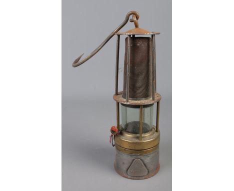 A vintage Davy miners safety lamp marked '196 NI 1968 6'. Also includes pin badge for the Uricani coal mine in Romania.