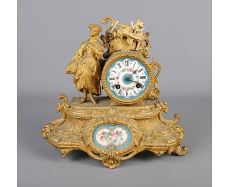 Phillipe H. Mourey (1840-1910) late 19th century gilt spelter and hand painted porcelain figurative mantle clock. Decorated i
