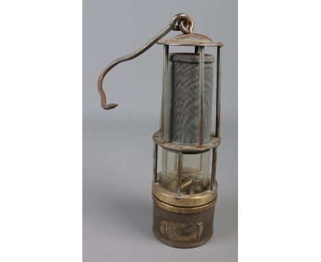 A vintage Davy miners safety lamp featuring methane measure to glass, swing handle and stamped 'BM 399/60' and 'LB1 A 2040/9/