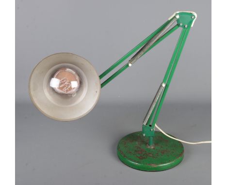 A Danish angle poise lamp in green.