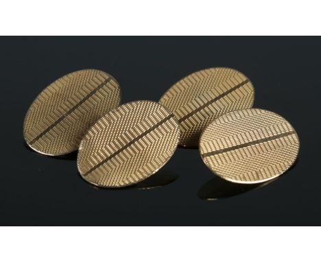 A pair of 9ct Gold cufflinks, with engine turned decoration, in box. Assayed for Birmingham, bearing date latter O. Total wei