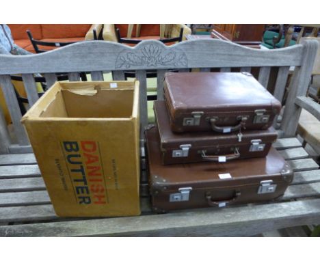 Three small vintage suitcases and an advertising box 