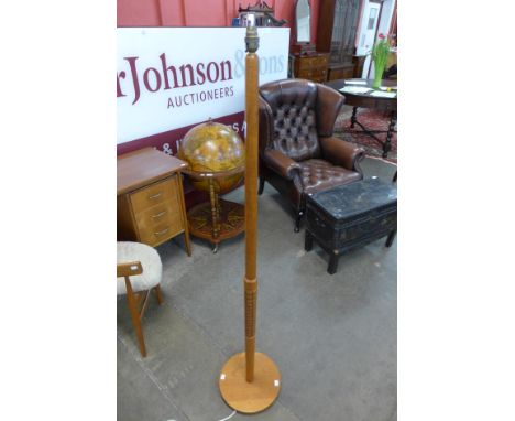 A teak standard lamp 