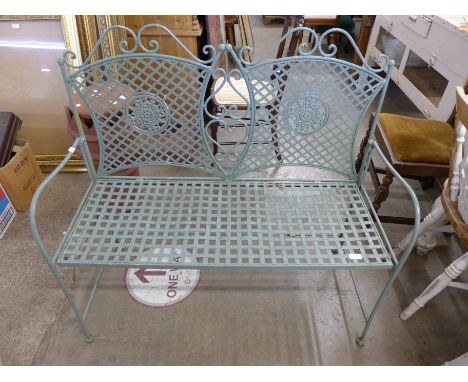 A painted metal garden bench 