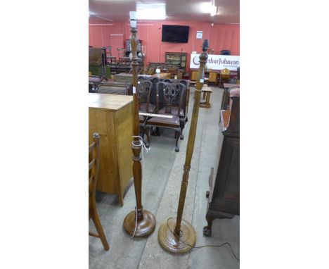 A carved oak standard lamp and a beech standard lamp 