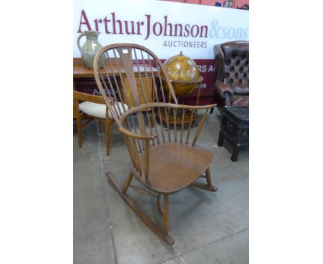 An Ercol Golden Dawn elm and beech Windsor rocking chair 