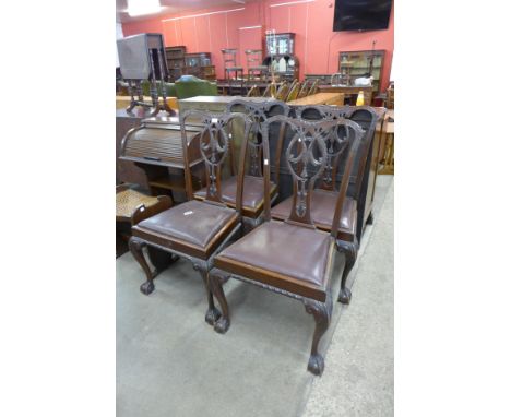 A set of four Chippendale Revival mahogany dining chairs 
