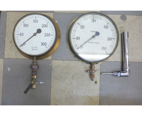 Two vintage pressure gauges and a thermometer 