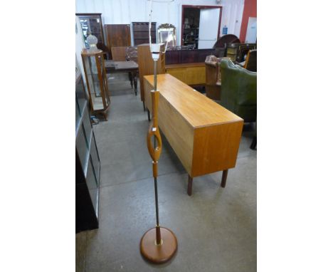 A teak standard lamp 