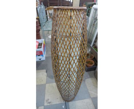 A wicker floor standing lamp 