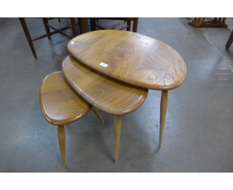 An Ercol Blonde elm and beech pebble shaped nest of tables 