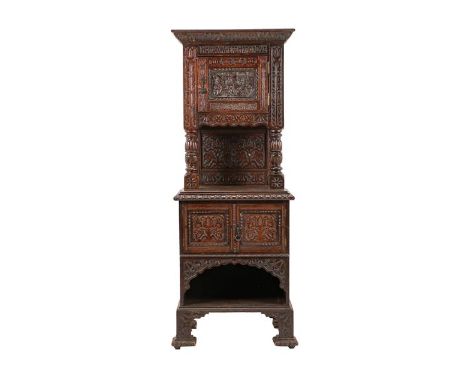 A Victorian Carved Oak Free-Standing Cupboard, 3rd quarter 19th century, carved in relief and named HONOR WEAR HONOR DYE abov