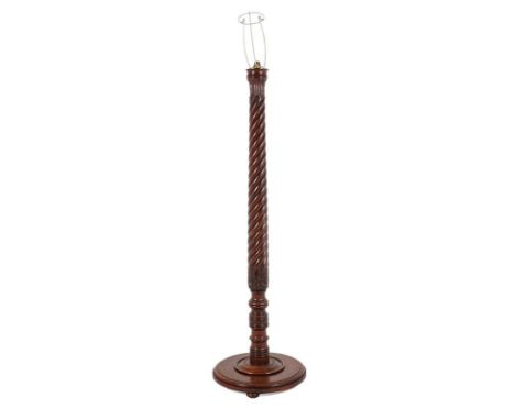 A Carved Mahogany Standard Lamp, 19th century and adapted, with acanthus leaf and spiral turned support on moulded circular b