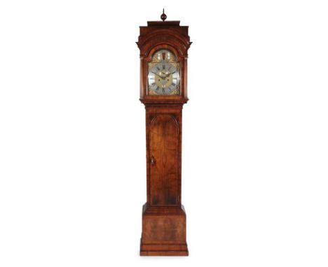 A Walnut Eight Day Longcase Clock, case with caddied pediment, glazed viewing side windows, arched trunk door with matched wa