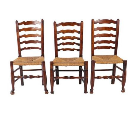A Harlequin Set of Six Lancashire Ash, Rush-Seated and Ladder-Back Chairs, mid 19th century, with curved horizontal splats, o