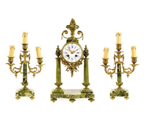 A French Green Marble Portico Striking Mantel Clock with Garniture, circa 1900, surmounted by an urn finial, Portico column c