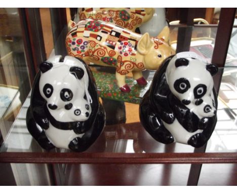 Pair of Wade panda money boxes together with a ceramic pig