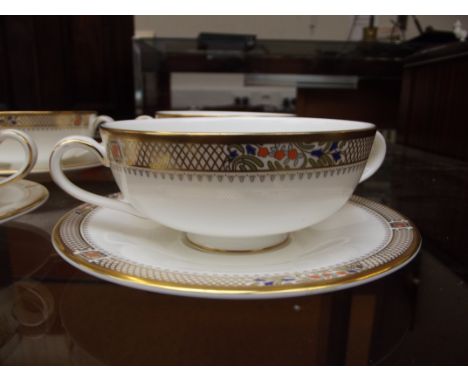 Set of six Minton soup dishes and saucers