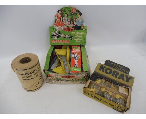 A boxed Compactum 'Three in one' combination knife fork and spoon set with a counter top Koray dispensing box and a roll of H