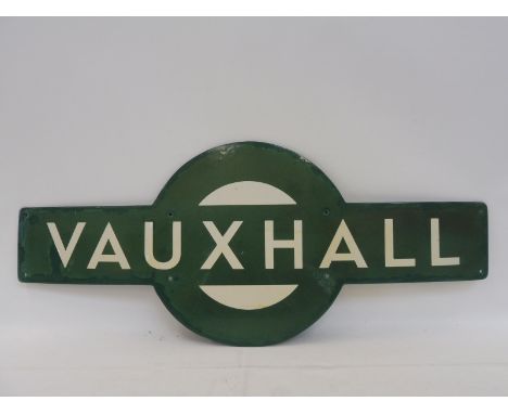 A Southern Region railway enamel station target for 'Vauxhall', with retouching and repairs to the edge all round, 31 x 13".