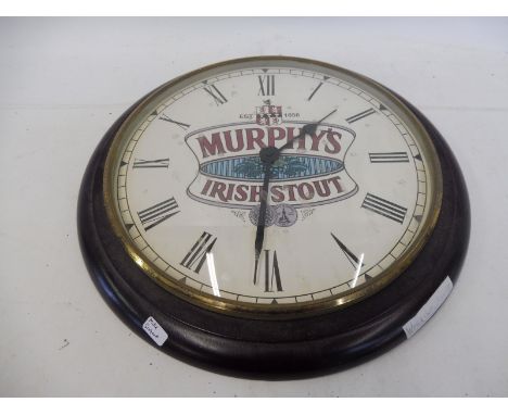 A reproduction Murphy's Irish Stout circular wall clock, 12 3/4" diameter.
