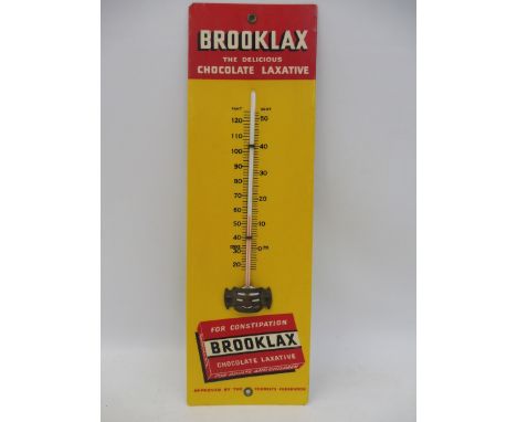 A Brooklax Chocolate Laxative celluloid covered thermometer, 4 x 13 1/4".