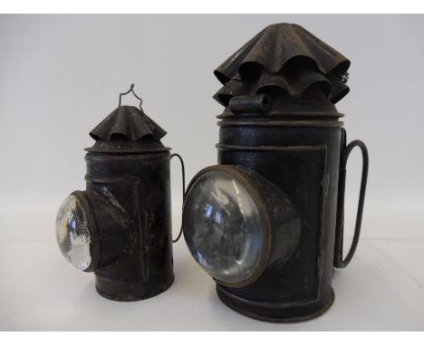 A railway locomotive lamp with bull's eye lens and one smaller. 